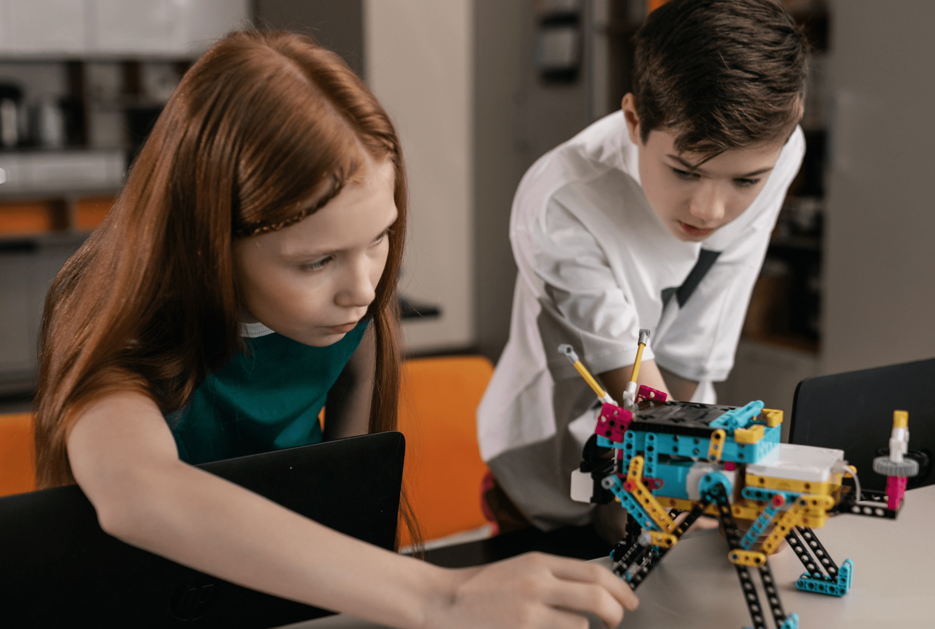 children attending robotics summer camp.